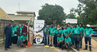 group of people in green shirts