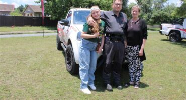 man with two women at his sides