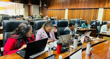 women in a council chamber