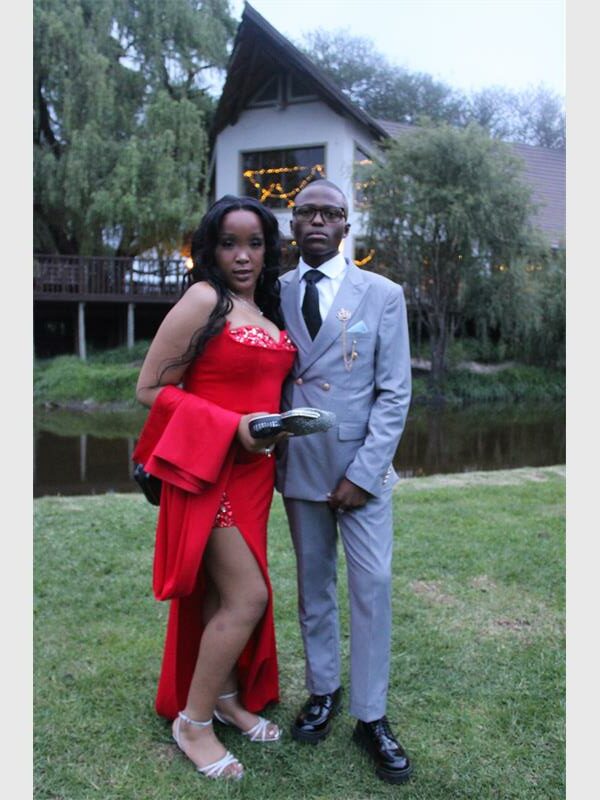 girl with red dress and boy in grey suit