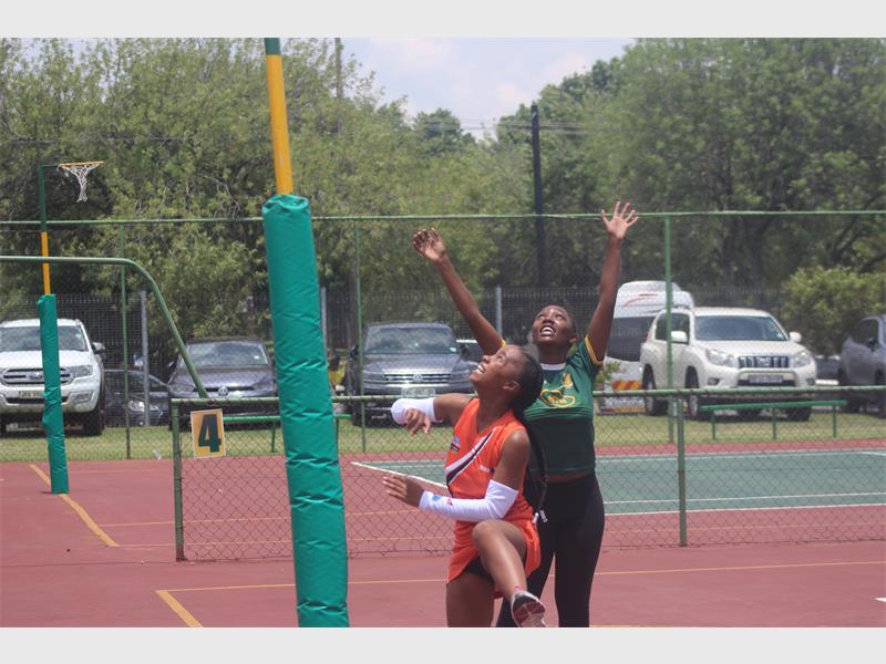 Netball players practicing.