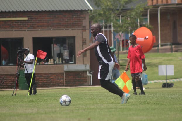 New Vaal player kicks off.