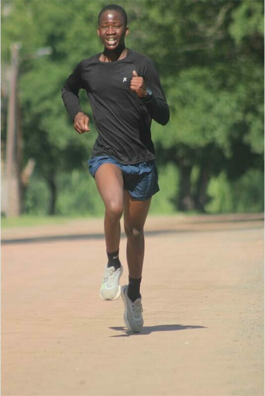 This parkrunner sprints to the end line.