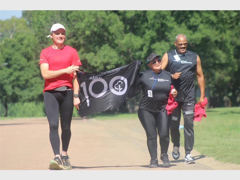 Eugene Viljoen holds the banner for Daphne and Hendrik Slinger.