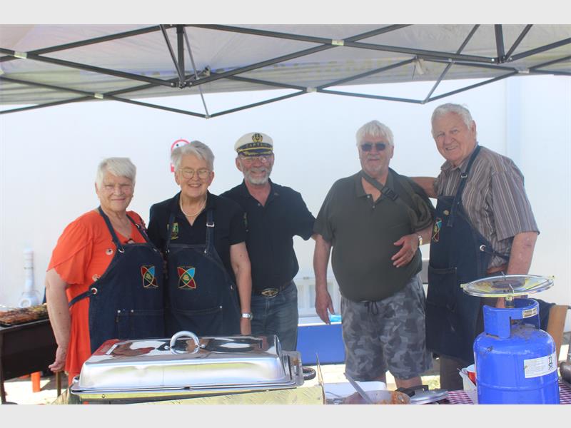old people at a stall