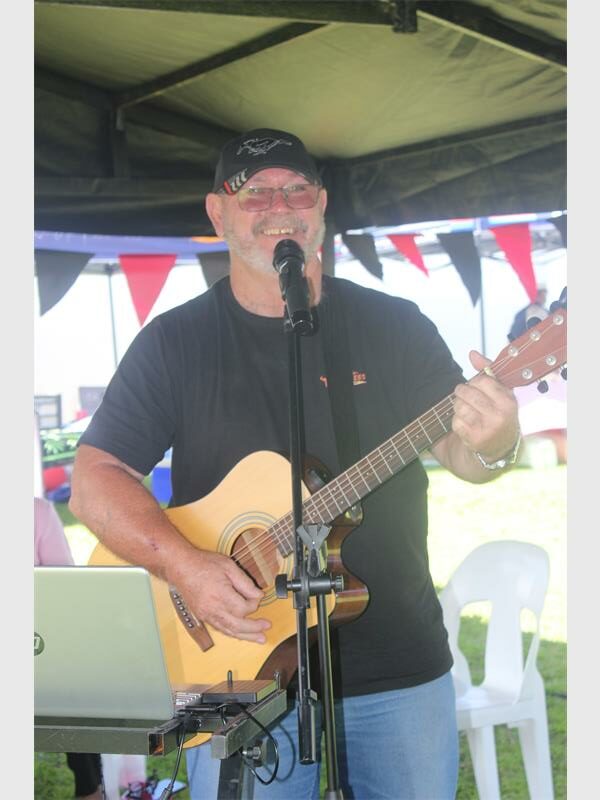 man with guitar and microphone
