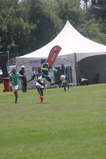 New Vaal player soars through the air to get the ball.
