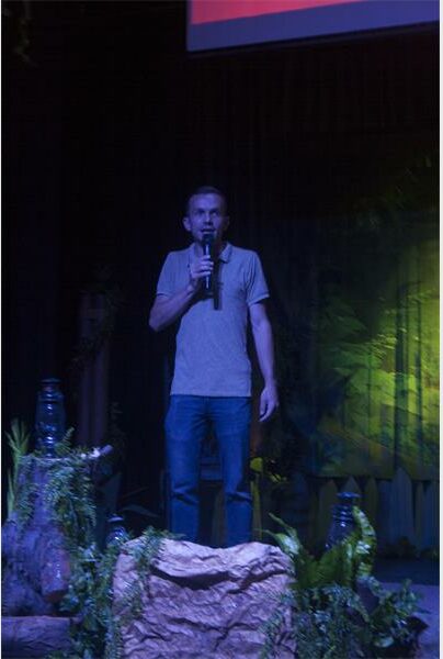 man onstage with microphone