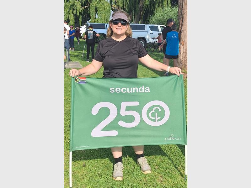 woman with a 250 banner