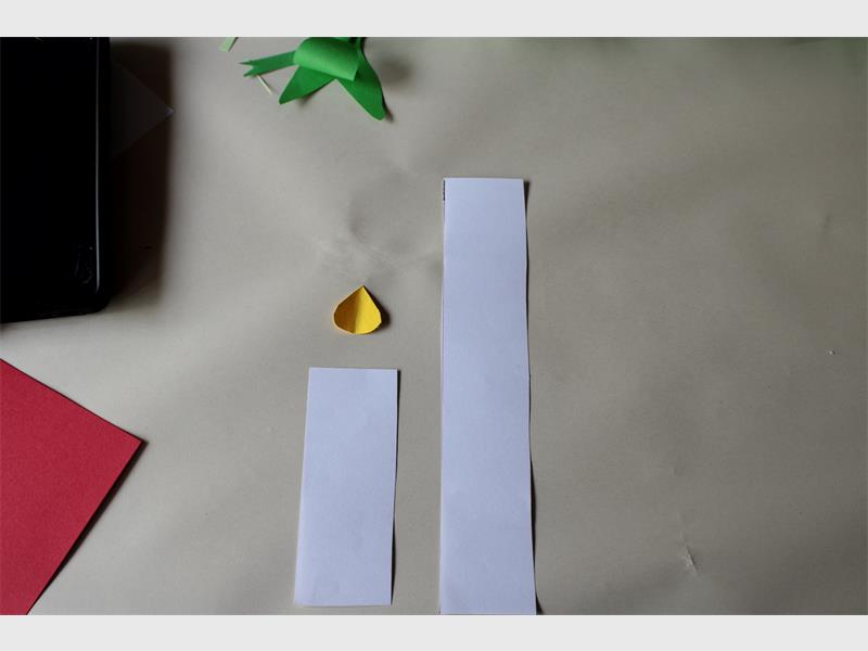 white paper cut to make a candle