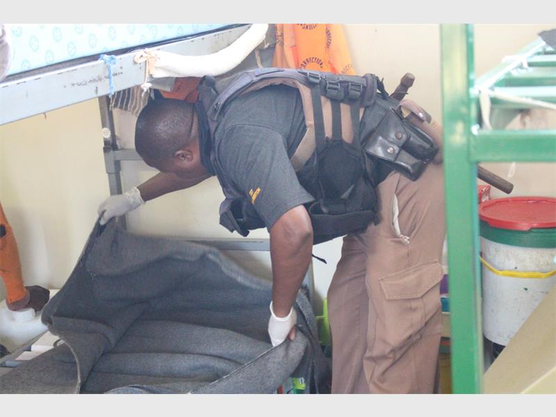 man searches a bunk bed