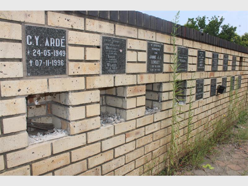 a vandalised wall of remembrance