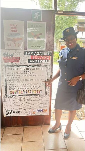 policewoman at a notice board.