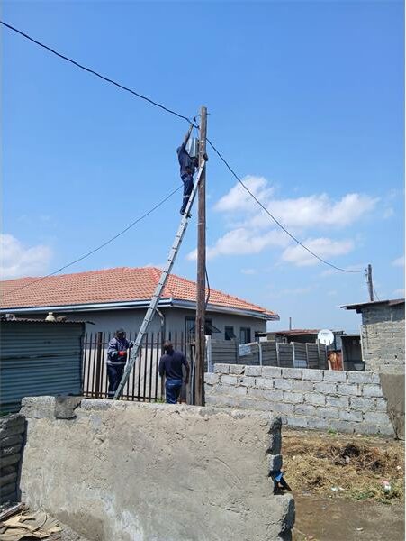 municipal employee working on an electricity cable