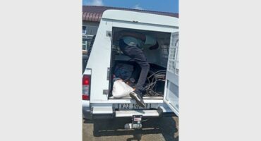 suspect in the back of a police van