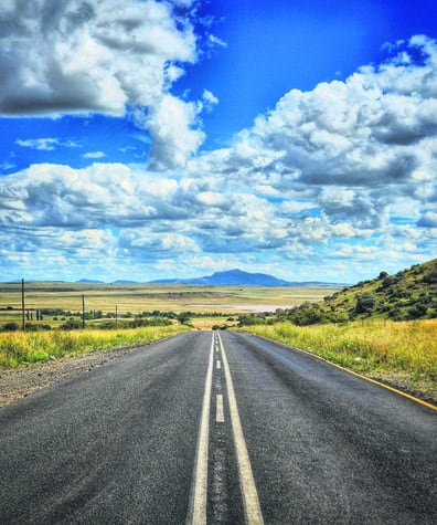 a photo of a road and sky