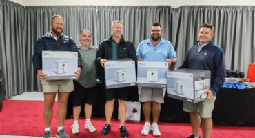 four men with prizes