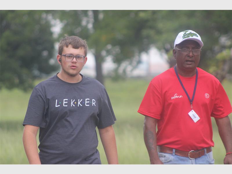 Two men walk in the park