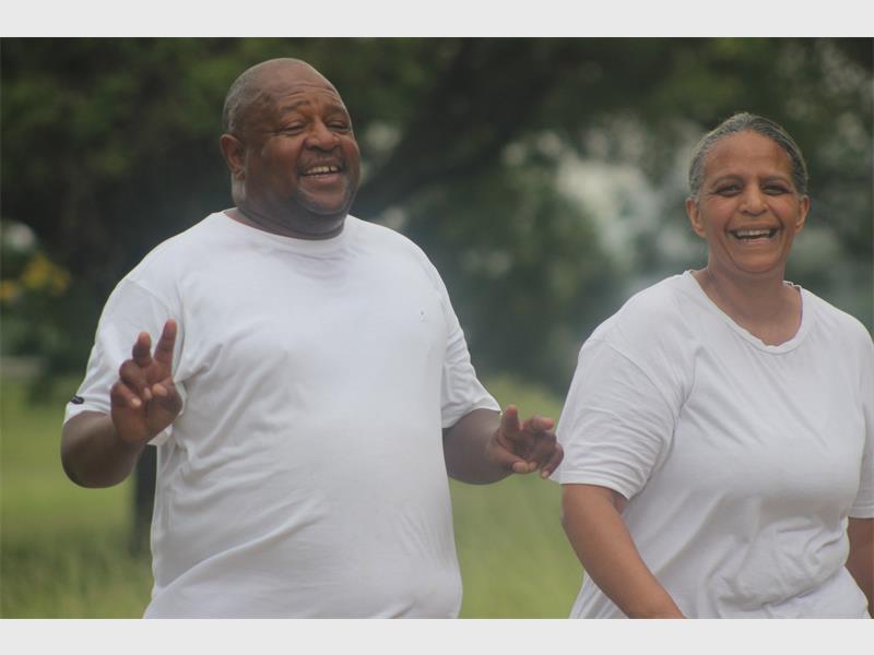 couple in white t shirts doing exercise