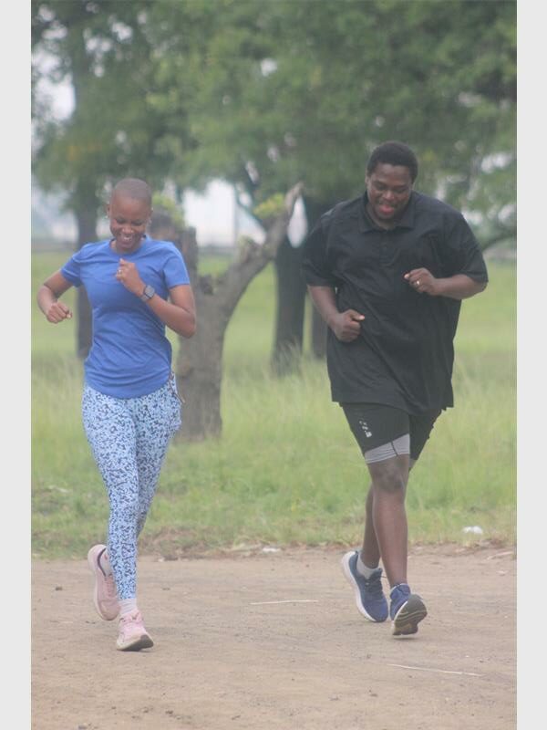Two people running in the park