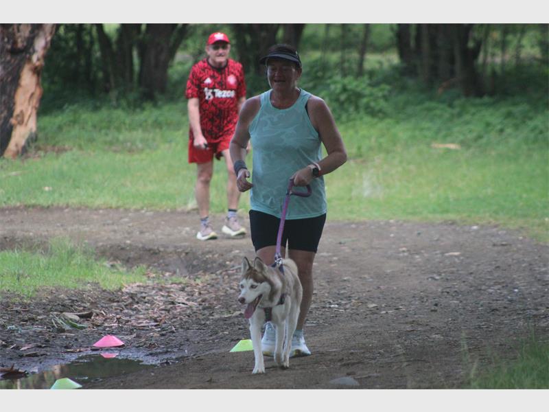 woman running with her dog