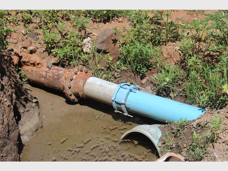 Water pipe leak, damage, and repair in progress.
