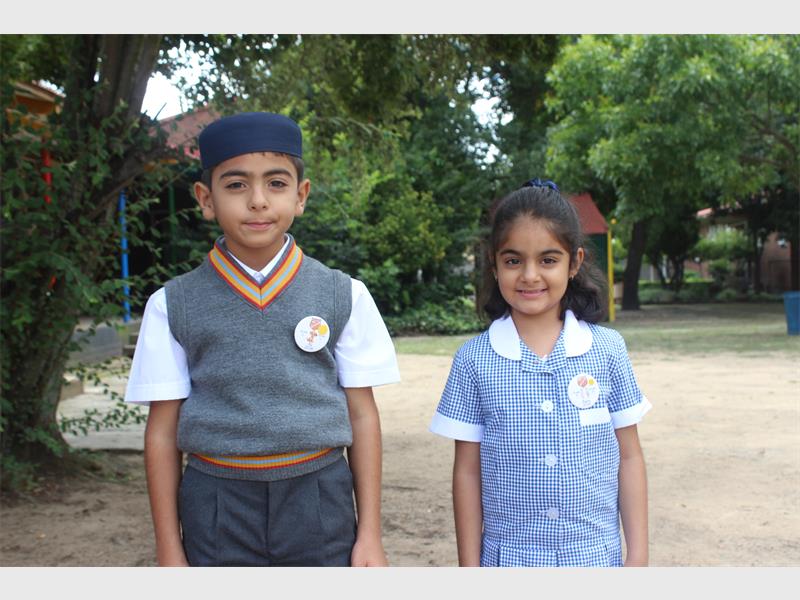 boy and girl in school uniforms