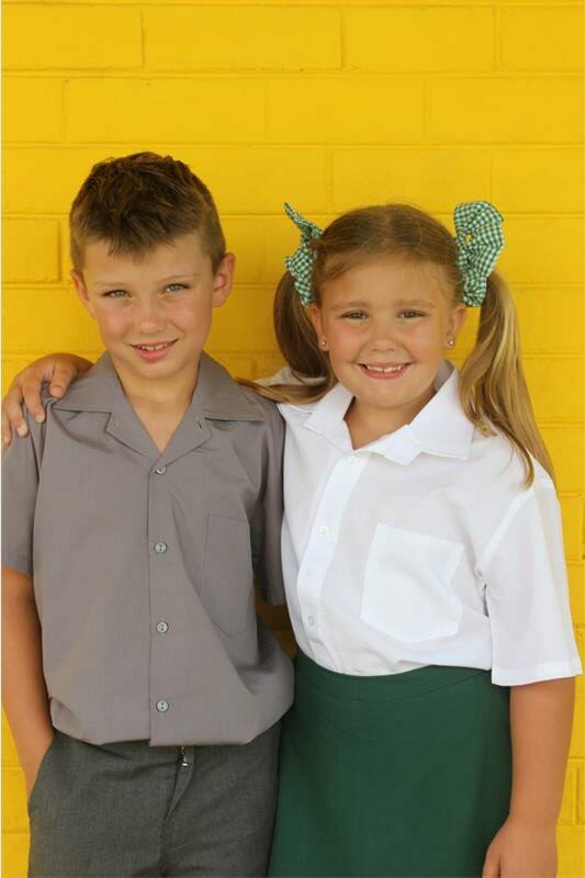 boy and girl in school uniforms