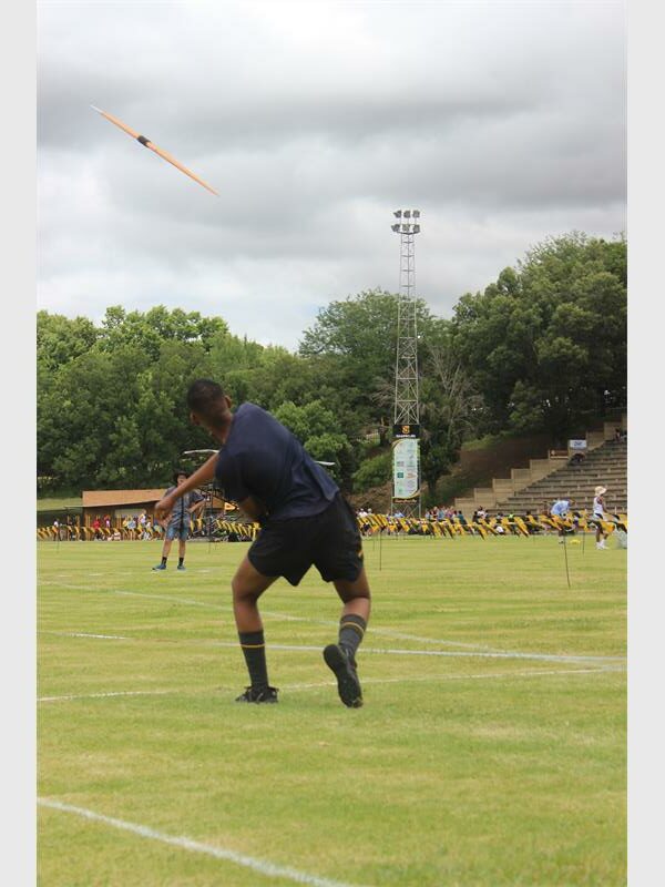 boy throws a spear in athletics meeting
