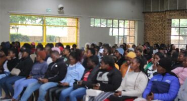 people sitting a town hall