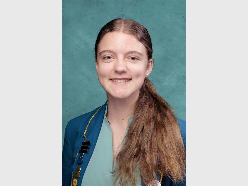 girl with dimples wearing a school uniform