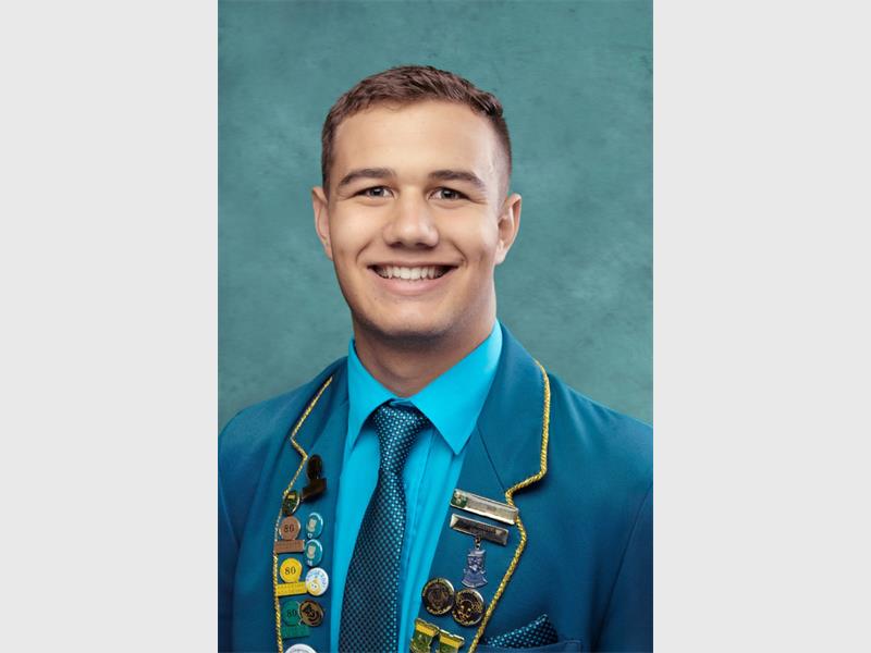 boy with blue school uniform and tie