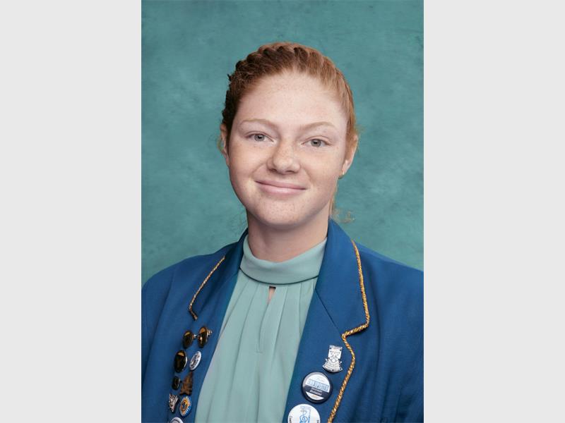 girl with red hair wearing school uniform
