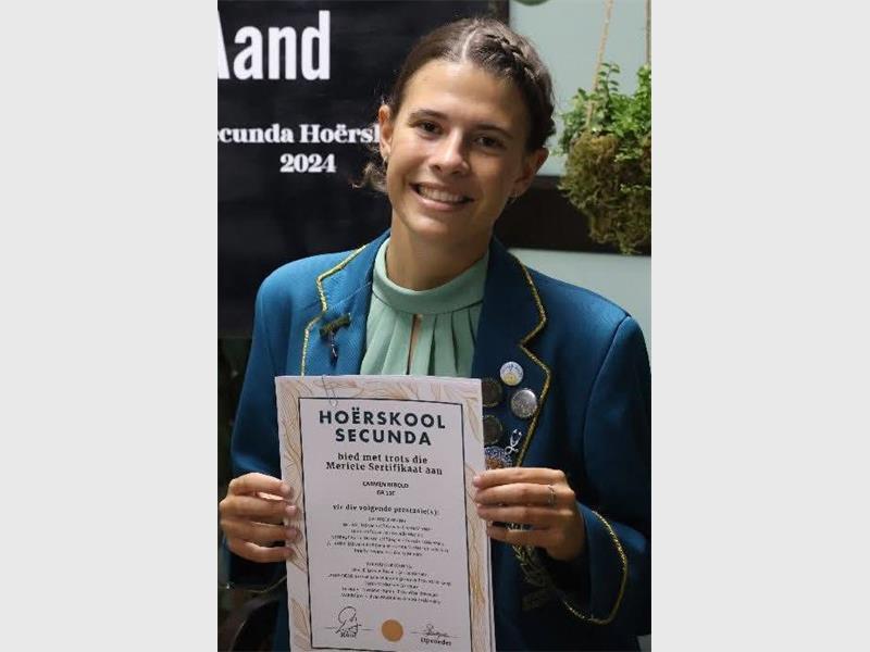 girl with her matric certificate