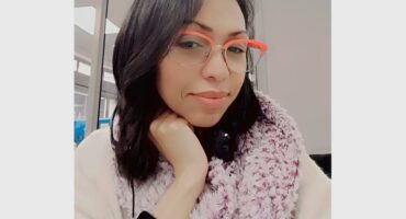 woman with her had to her face