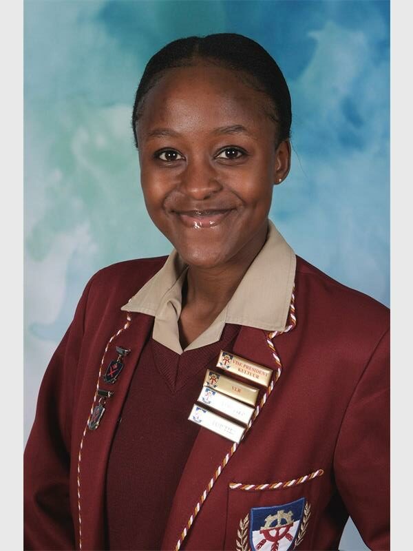black girl with maroon school uniform