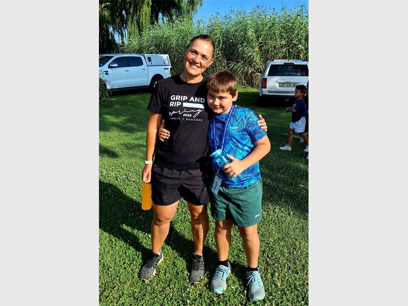 Woman and boy at a parkrun