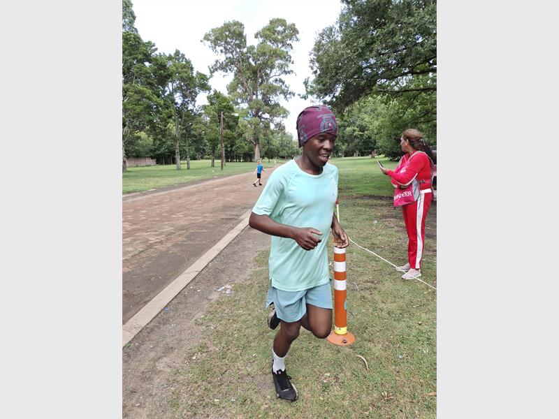 runner reaches the finish line