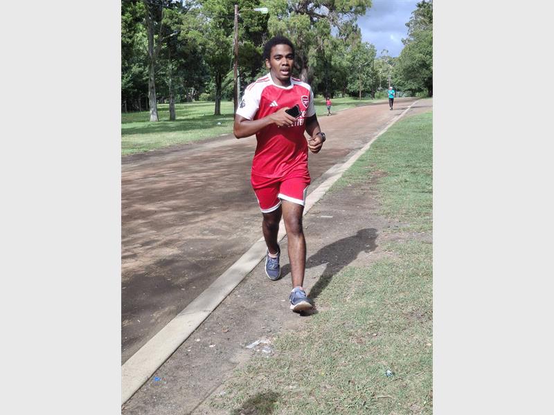 A runner in a red outfit
