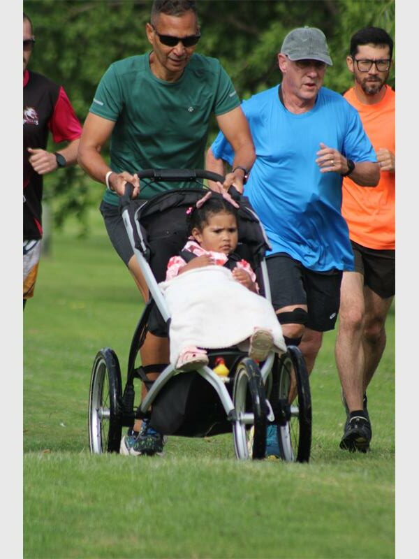 running man with a pram