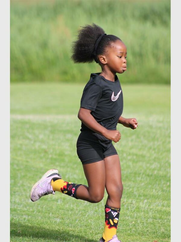 girl dress in black is running outside