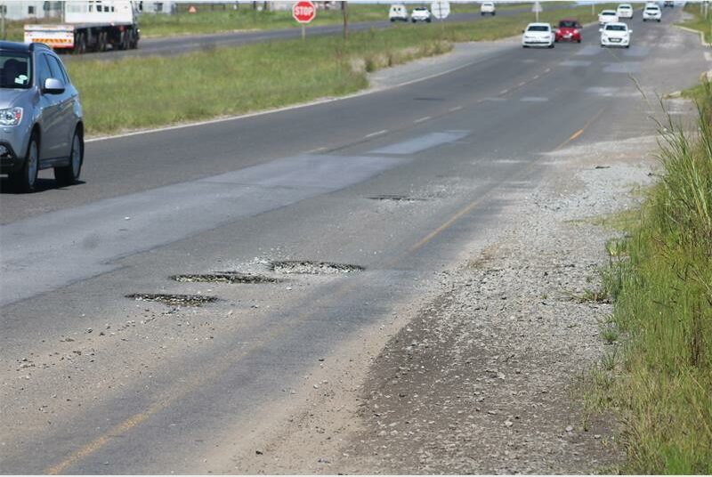 road riddled with potholes