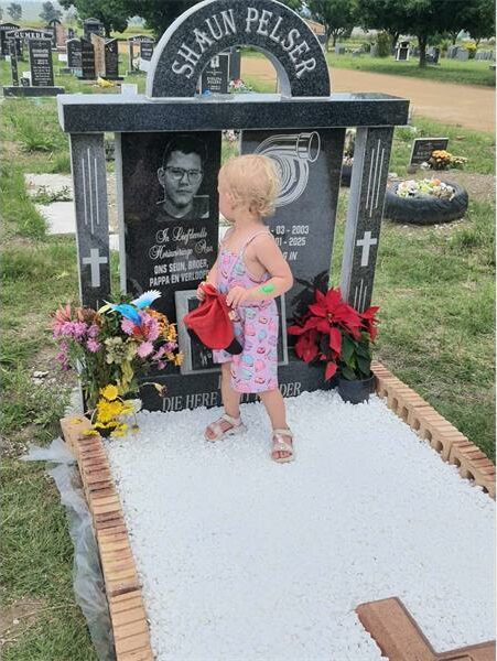 little girl on a man's grave