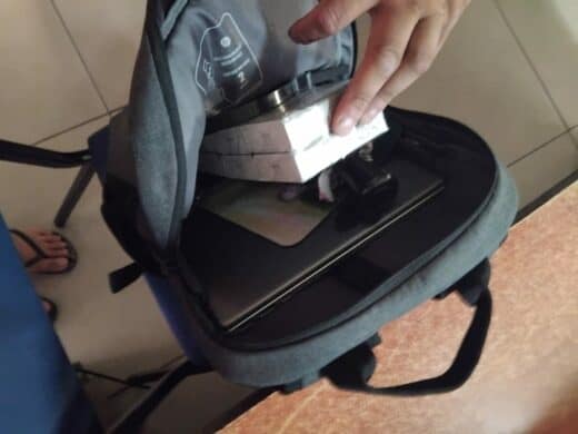 a laptop bag and cell phones