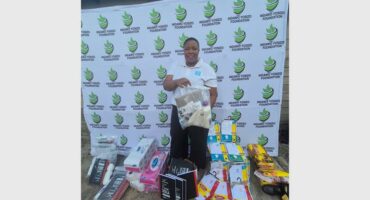 woman surrounded by donated school goods