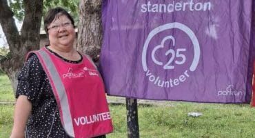 woman with a volunteer bib
