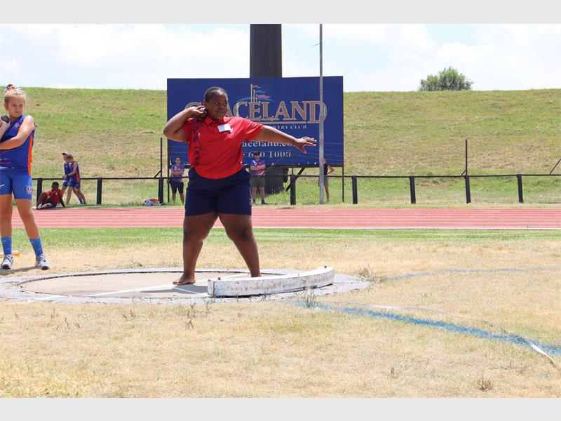 an athlete doing shot put