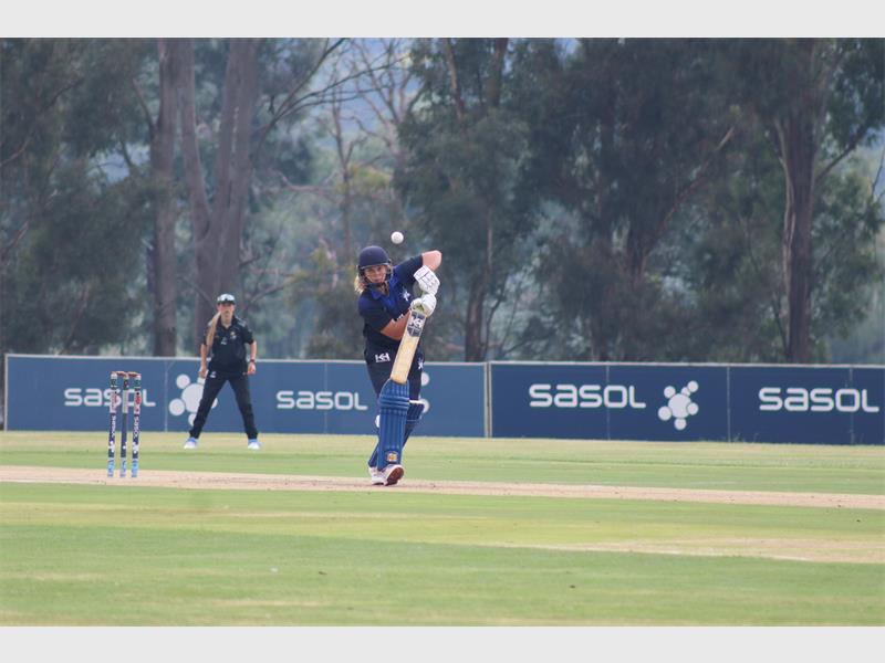 a cricket player faces an oncoming ball