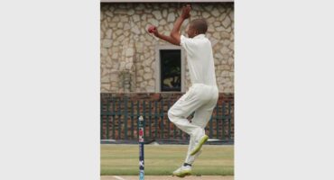 a cricket player bowls