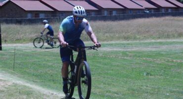man cycling in the field